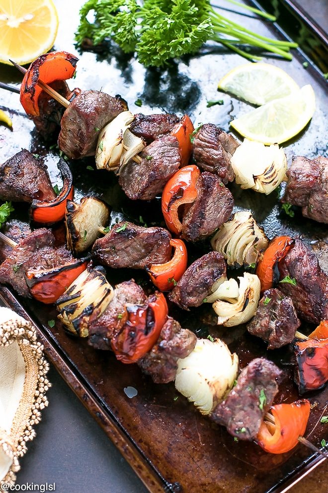 Easy Marinated Grilled Greek Lamb kebabs. Bulgarian/Mediterranean style seasoning, tender pieces of marinated leg of lamb on skewers with vegetables and grilled to perfection.