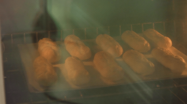 Easy Chocolate Eclair Recipe being baked in the oven on a metal tray