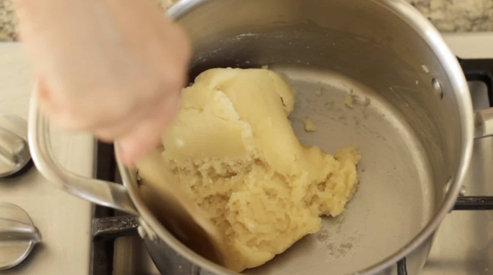 Dough ball being formed as it pulls away from the sides for choux pastry