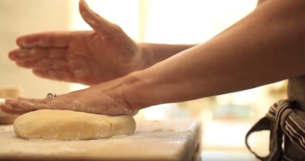 Pressing down dough for a tart recipe
