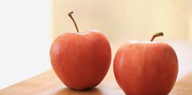 Two Gala Apples on a Cutting Board