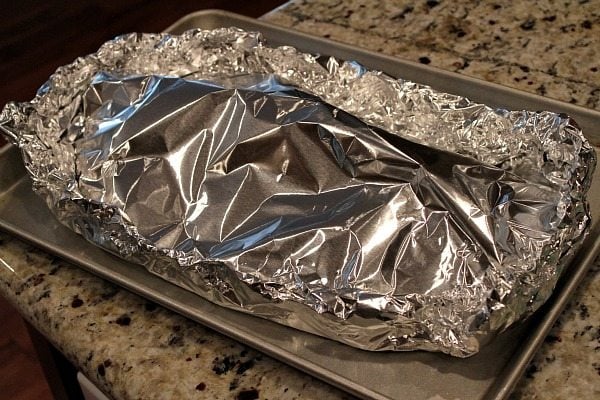 ribs wrapped with foil ready for the oven