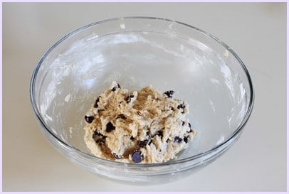 Eggless Chocolate Chip Cookies (BEST Eggless Cookies) fold chocolate chips into the dough